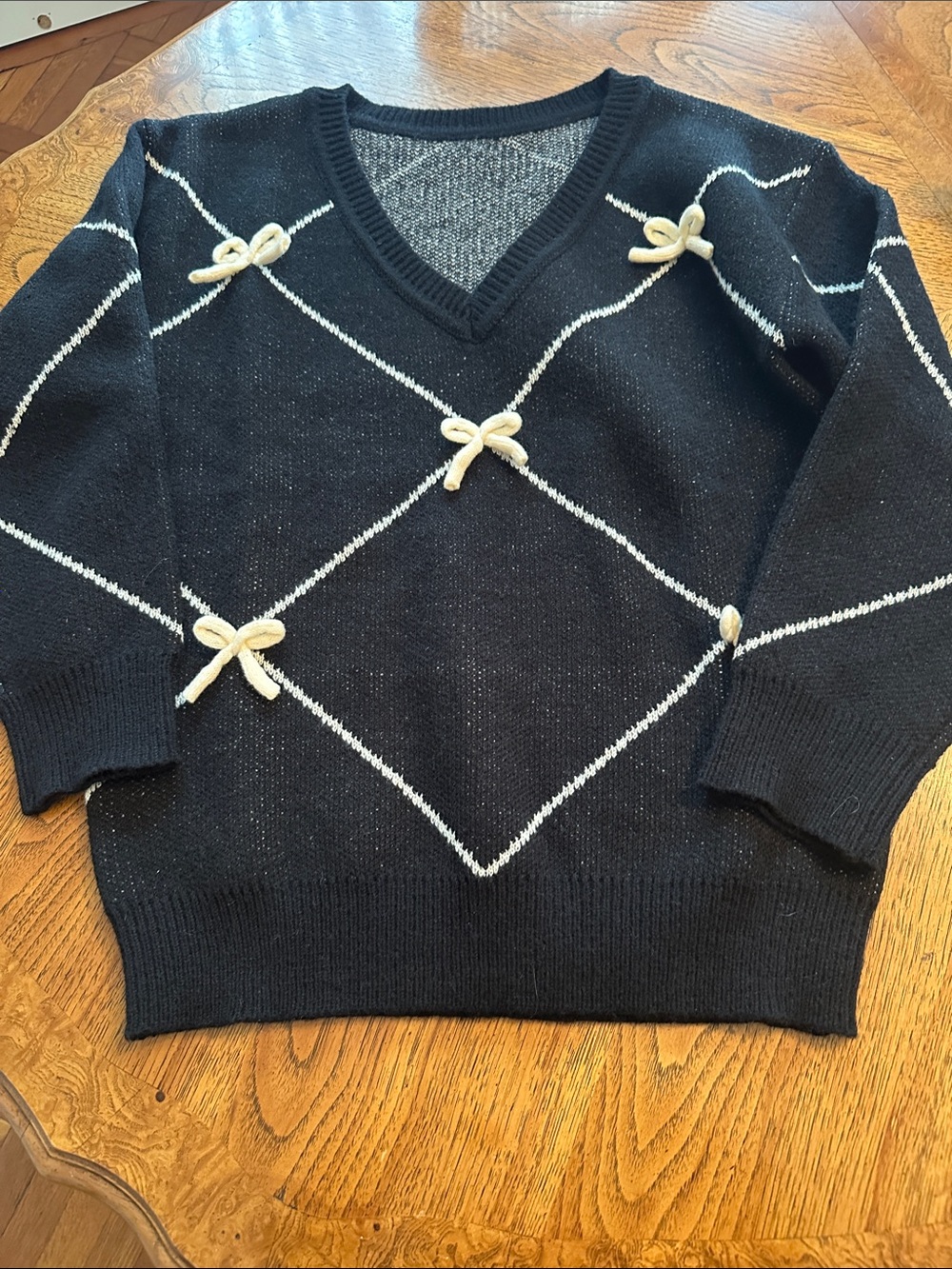 SHEIN Black V-Neck Sweater with Cream Bow Accent